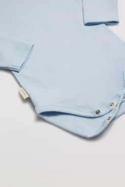 Body bebé básico manga larga solapas celeste