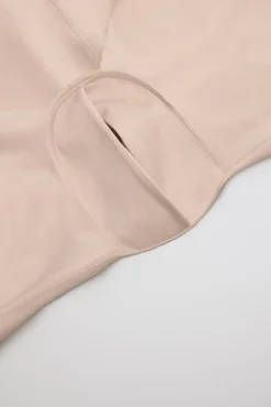 Body-up reductor con abertura acabados invisibles nude