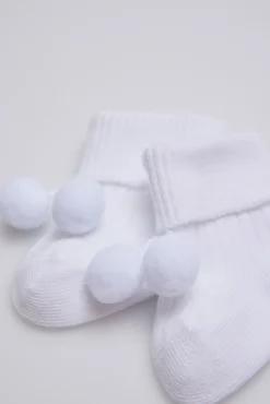 Calcetines canalé con borlas recién nacido blanco