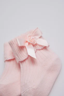 Calcetines canalé con lazo recién nacido rosa
