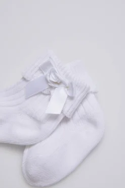 Calcetines canalé con lazo recién nacido blanco
