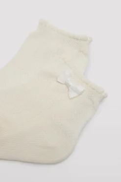 Calcetines infantiles de ceremonia con lazo marfil