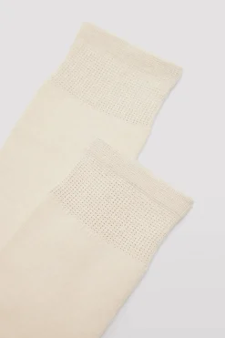 Calcetines infantiles largos algodón beige