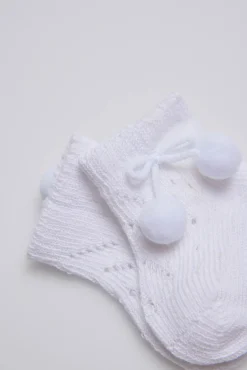 Calcetines perlé con borlas recién nacido blanco