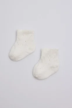 Calcetines perlé recién nacido marfil