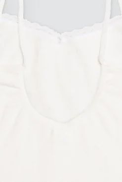 Conjunto camiseta y braguita caladas de niña marfil