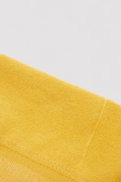 Leotardo clásico bebé amarillo mostaza