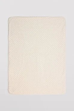 Manta de bebé topitos marfil