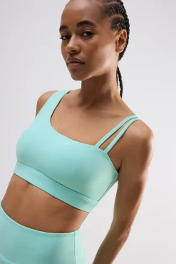 Sujetador deportivo asimétrico sujeción ligera celeste